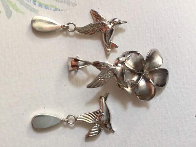 Hummingbird and plumaria necklace and earrings in Sterling Silver