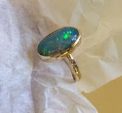 Solitaire opal and gold ring, Front